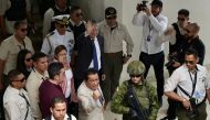 Ecuadorean President Guillermo Lasso gestures after voting during the local election at the Ileana Espinel Cedeٌo school in Guayaquil, Ecuador on February 5, 2023. (Photo by Marcos Pin / AFP)