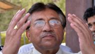 In this file photo taken on March 24, 2013 Pakistan's former military ruler Pervez Musharraf prays after arriving at the Karachi International airport from Dubai. (Photo by Aamir Qureshi / AFP)