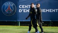 File photo: Paris Saint Germain's Argentinian forward Lionel Messi (left) and Italian midfielder Marco Veratti arrive for a training session at Sain-Germain-en-Laye. AFP
