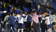 Hilal's players celebrate their victory in the FIFA Club World Cup semi-final football match between Brazil's Flamengo and Saudi Arabia's Al-Hilal at the Ibn Batouta Stadium in Tangier on February 7, 2023. (Photo by Fadel Senna / AFP)