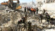Algerian rescue teams take part in the search and rescue operations in Syria's northern city of Aleppo on February 8, 2023, two days after a deadly earthquake struck Syria and Turkey.   (Photo by AFP)