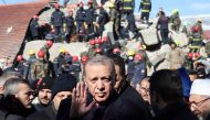 Turkish President Recep Tayyip Erdogan tours the site of destroyed buildings during his visit to the city of Kahramanmaras in southeast Turkey, two days after the severe earthquake that hit the region on February 8, 2023. (Photo by Adem Altan / AFP)