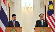 Malaysia's Prime Minister Anwar Ibrahim (left) and Thailand's Prime Minister Prayut Chan-O-Cha attend a joint press conference during an official state visit at Government House in Bangkok on February 9, 2023. (Photo by Lillian SUWANRUMPHA / AFP)