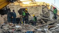 Rescuers carry out search operations among the rubble of a collapsed building in Adiyaman, Turkey on February 9, 2023, three days after a 7,8-magnitude earthquake struck southeast Turkey. Photo by Ilyas AKENGIN / AFP