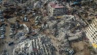 This aerial view shows collapsed buildings during ongoing rescue operation in Kahramanmaras, on February 10, 2023. (Photo by Ozan Kose / AFP)