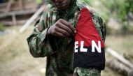 A rebel of Colombia's Marxist National Liberation Army (ELN) shows his armband while posing for a photograph, in the northwestern jungles, Colombia August 31, 2017. REUTERS/Federico Rios/File Photo
