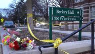 Flowers and crime scene tape are shown outside Berkey Hall on the campus of Michigan State University on February 14, 2023 in East Lansing, Michigan. 