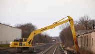 EAST PALESTINE, OH - FEBRUARY 14: Workers remove contaminated dirt near the railroad tracks on February 14, 2023 in East Palestine, Ohio. A train operated by Norfolk Southern derailed on February 3, releasing toxic fumes and forcing evacuation of residents. Angelo Merendino/Getty Images/AFP (Photo by Angelo Merendino / GETTY IMAGES NORTH AMERICA / Getty Images via AFP)