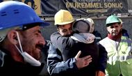 The uncle of Aleyna Olmez (C), reacts after the 17-year-old woman was rescued from a collapsed building, 248 hours after the 7.8-magnitude earthquake which struck parts of Turkey and Syria, in Kahramanmaras on February 16, 2023. (Photo by OZAN KOSE / AFP)