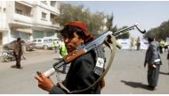 A Houthi supporter looks on as he carries a weapon during a gathering in Sanaa, Yemen on April 2, 2020.