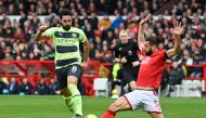 Manchester City's German midfielder Ilkay Gundogan (L) fights for the ball with Nottingham Forest's Brazilian defender Felipe during the English Premier League match between Nottingham Forest and Manchester City at The City Ground in Nottingham, central England, on February 18, 2023. (Photo by JUSTIN TALLIS / AFP)