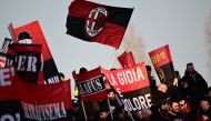 AC Milan fans cheer prior to the Italian Serie A football match between Monza and AC Milan on February 18, 2023 at the Brianteo Stadium in Monza. (Photo by Marco BERTORELLO / AFP)
