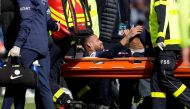 PSG's Neymar is carried off the field on a stretcher after suffering from an injury during the match against Lille at the Parc des Princes stadium, in Paris, France. (AFP)