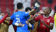 Al Duhail goalkeeper Salah Zakaria celebrates with teammates after their win over Al Rayyan on Sunday. PIC: RAJAN VADAKKEMURIYIL