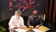 Vice Chairman & EVP of Ali Bin Ali Holding Nabeel Ali Bin Ali (left) and Turkish model and actor Burak Özçivit during the agreement signing. 