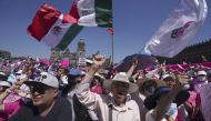 Anti-government demonstrators shout slogans against Mexican President Andres Manuel Lopez Obrador, during a march against recent reforms to the country's electoral law that they say threaten democracy, in Mexico City's main square, The Zocalo, Sunday, February 26, 2023. (AP Photo/Fernando Llano)