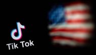 This file illustration photo taken on September 14, 2020 shows the logo of the social network application TikTok and a US flag shown on the screens of two laptops in Beijing. - The White House on Monday, February 28, 2023, gave federal agencies 30 days to purge Chinese-owned video-snippet sharing app TikTok from all government-issued devices, setting a deadline to comply with a ban ordered by the US Congress. (Photo by NICOLAS ASFOURI / AFP)