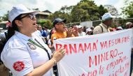 Workers of Canadian First Quantum Minerals mining company hold a protest in front of the Marine Authority of Panama, in Panama City on March 1, 2023, following the company announcement -last February 23- of the suspension of operations at a major mine on the grounds that it was being blocked from exporting copper abroad. (Photo by Luis ACOSTA / AFP)
