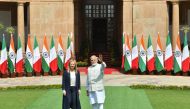 India's Prime Minister Narendra Modi and his Italian counterpart Giorgia Meloni pose before their meeting at the Hyderabad House in New Delhi on March 2, 2023. - Meloni said on March 2 she hoped India would use its G20 presidency to broker an end to the Ukraine war after unveiling a new strategic partnership with New Delhi. (Photo by AFP)
