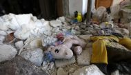 A child's toy lies amidst the rubble of a home destroyed in a deadly earthquake in the town of Jandaris, in Syria's rebel-held part of Aleppo province on February 9, 2023. (Photo by Bakr Alkasem / AFP)