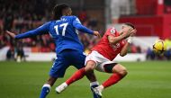 Nottingham Forest's defender Renan Lodi (right) is fouled by Everton's Nigerian midfielder Alex Iwobi during the English Premier League match between Nottingham Forest and Everton at The City Ground in Nottingham, central England, on March 5, 2023. (Photo by Oli SCARFF / AFP)