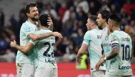 Inter Milan's Armenian midfielder Henrikh Mkhitaryan (second left) celebrates with Inter Milan's Italian defender Francesco Acerbi after opening the scoring during the Italian Serie A football match between Inter and Lecce on March 5, 2023 at the San Siro (Giuseppe-Meazza) stadium in Milan. (Photo by Isabella BONOTTO / AFP)