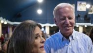 File Photo: Then presidential hopeful Joe Biden talks with fellow candidate Marianne Williamson at the Wing Ding Dinner in Clear Lake, Iowa, August 9, 2019. (Photo by Alex Edelman / AFP)