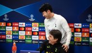 Tottenham Hotspur's South Korean striker Son Heung-Min (R) jokes with Tottenham Hotspur's Italian head coach Antonio Conte (L) as he leaves during a press conference at the Tottenham Hotspur Football Club Training Ground, in Enfield, near London on March 7, 2023, on the eve of their UEFA Champions League round of 16 second-leg football match against AC Milan. (Photo by Daniel LEAL / AFP) 