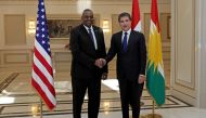 President of the Iraqi Kurdistan autonomous region Nechirvan Barzani (right) receives US Defense Secretary Lloyd Austin in Arbil on March 7, 2023. (Photo by SAFIN HAMED / AFP)