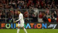 Paris Saint-Germain's French forward Kylian Mbappe walks over the pitch after the UEFA Champions League round of 16. (Photo by Odd ANDERSEN / AFP)