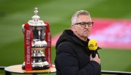 In this file photo taken on March 21, 2021, BBC TV presenter Gary Lineker prepares to broadcast inside the make-shift television studio ahead of the English FA Cup quarter-final football match between Leicester City and Manchester United at King Power Stadium in Leicester, central England.  (Photo by Oli SCARFF / POOL / AFP) 