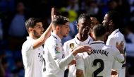 Real Madrid's Spanish midfielder Marco Asensio (left) celebrates with teammates scoring his team's third goal during the Spanish league football match between Real Madrid CF and RCD Espanyol at the Santiago Bernabeu stadium in Madrid on March 11, 2023. (Photo by JAVIER SORIANO / AFP)