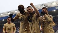 Chelsea's Croatian midfielder Mateo Kovacic (second right) celebrates scoring the team's third goal with Chelsea's English defender Trevoh Chalobah (second left) during the English Premier League football match between Leicester City and Chelsea at King Power Stadium in Leicester, central England on March 11, 2023. (Photo by Darren Staples / AFP)