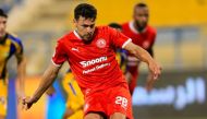 Al Arabi's Youssef Msakni shoots from the penalty spot to score a goal against Al Gharafa.