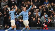 Manchester City’s Norwegian striker Erling Haaland (right) celebrates after scoring the team’s sixth goal, his fifth,  during the Champions League round of 16 second-leg match against RB Leipzig. AFP