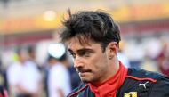 In this file photograph taken on March 5, 2023 Ferrari's Monegasque driver Charles Leclerc arrives on the racetrack before the Bahrain Formula One Grand Prix at the Bahrain International Circuit in Sakhir. Photo by ANDREJ ISAKOVIC / AFP
