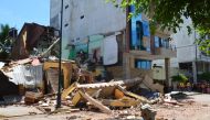Destroyed buildings are seen after an earthquake in the city of Machala, Ecuador on March 18, 2023. Photo by Gleen Suarez / AFP