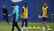 Barcelona's Spanish coach Xavi (L) attend a training session at the Joan Gamper training ground in Sant Joan Despi, on March 18, 2023, on the eve of the Spanish league 'El Clasico' football match between Barcelona and Real Madrid. (Photo by LLUIS GENE / AFP)