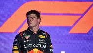 Red Bull Racing's Dutch driver Max Verstappen reacts on the podium after placing second at the end of the Saudi Arabia Formula One Grand Prix at the Jeddah Corniche Circuit in Jeddah on March 19, 2023. Photo by Ben Stansall / AFP