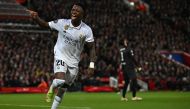 Real Madrid's Brazilian forward Vinicius Junior celebrates scoring the team's second goal during the UEFA Champions League last 16 first leg football match between Liverpool and Real Madrid at Anfield in Liverpool, north west England on February 21, 2023. (Photo by Paul Ellis / AFP)