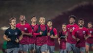 Qatar U23 players in action during a training session.