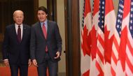 Canada's Prime Minister Justin Trudeau (right) walks with US President Joe Biden after welcoming him at Parliament Hill in Ottawa, Canada, on March 24, 2023. (Photo by Mandel Ngan / AFP)