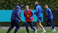 (Left to right) England's Dutch assistant coach Jimmy Floyd Hasselbaink, England's midfielder Phil Foden, England's midfielder Eric Dier and England's defender Kieran Trippier take part in an England football team training session at the Tottenham Hotspur Training Ground, in Enfield, north London on March 25, 2023, the eve of their Euro 2024 qualifier against Ukraine. (Photo by Adrian DENNIS / AFP)
