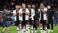 Germany's players applaud the fans after the international friendly football match Germany v Peru in Mainz, southern Germany, on March 25, 2023. Photo by Thomas KIENZLE / AFP