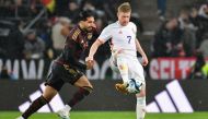 Belgium's midfielder Kevin De Bruyne (right) and Germany's midfielder Emre Can vie for the ball during the international friendly football match Germany v Belgium in Cologne, western Germany, on March 28, 2023. (Photo by UWE KRAFT / AFP)