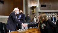 Senate Health, Education, Labor, and Pensions Committee Chairman Bernie Sanders (I-VT) greets Maggie Carter, a Starbucks barista from Knoxville, Tennessee, before the start of a second panel in the Dirksen Senate Office Building on Capitol Hill on March 29, 2023 in Washington, DC. (Photo by Anna Moneymaker / GETTY IMAGES NORTH AMERICA / Getty Images via AFP)
