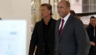 Former head coach of Saudi Arabia, French Herve Renard (L) and French Football Federation (FFF) Interim President Philippe Diallo arrive at the French Football Federation headquarters in Paris, on March 30, 2023. (Photo by FRANCK FIFE / AFP)