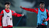 Al Wakrah's Jacinto Dala (right) with a team-mate during a training session.   