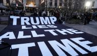 Police, media and a small group of protesters gather outside of a Manhattan courthouse after news broke that former President Donald Trump has been indicted by a grand jury on March 30, 2023 in New York City. (Photo by Spencer Platt/Getty Images via AFP) 