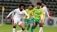 Al Sadd’s Akram Afif (left) in action during match against Al Wakrah at Saoud Bin Abdulrahman Stadium. RIGHT: Al Duhail’s Ferjani Sassi (left) celebrates with captain Karim Boudiaf after scoring his team’s first goal at Hamad Bin Khalifa Stadium. 